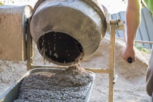 Mixer Pouring Ready Mix Concrete into Tray